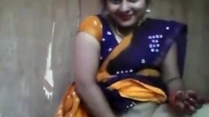 Innocent looking aunty playing with cucumber